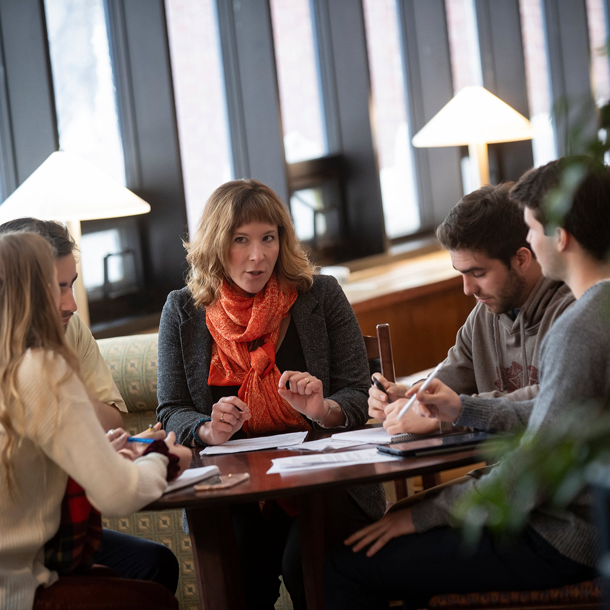 Faculty member sitting with students